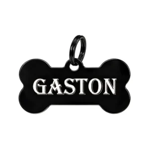 Médaille os noire gravée du prénom Gaston en lettres blanches, avec anneau noir